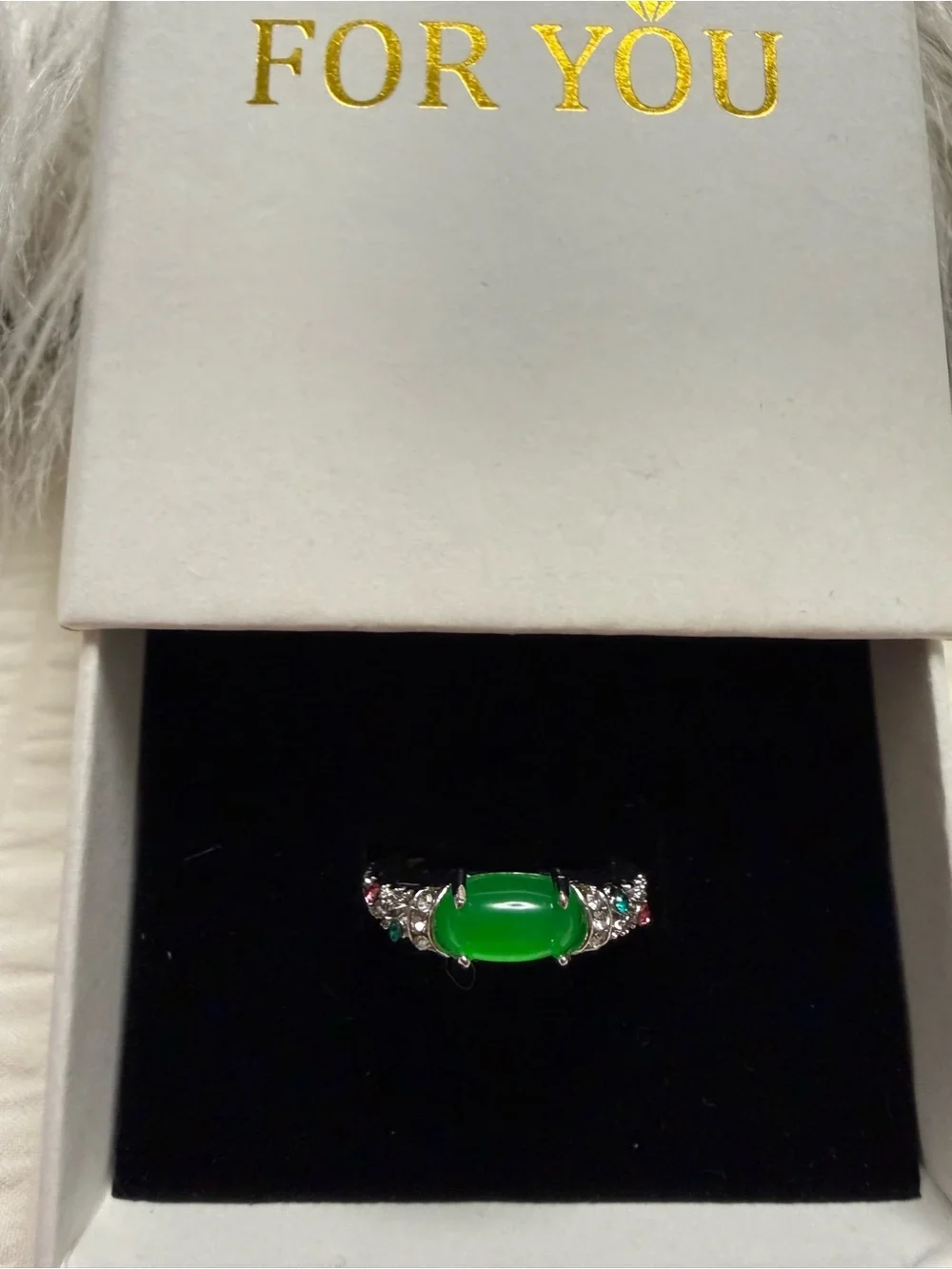 Emerald Green Cabochon Ring with Sparkling Accents